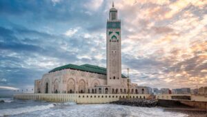 Casablanca travel guide Hassan II Mosque at sunset by the Atlantic Ocean