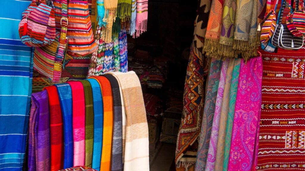 Colorful textiles and traditional goods at Souk El Had market in Agadir