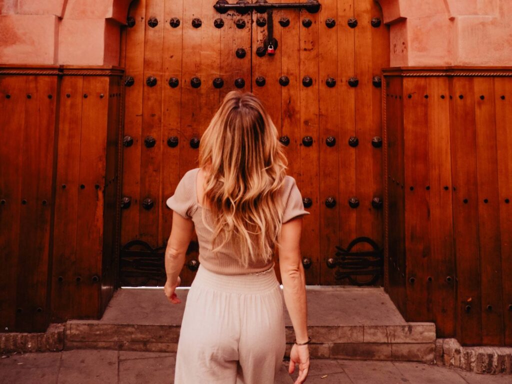 Guided medina walking tour in Marrakech through historic streets and traditional doors