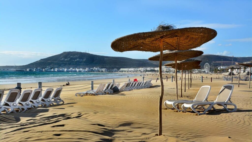 Visitors relaxing and walking on Agadir Beach