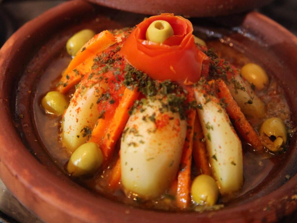 Traditional Moroccan tagine served in Fes with vegetables and olives