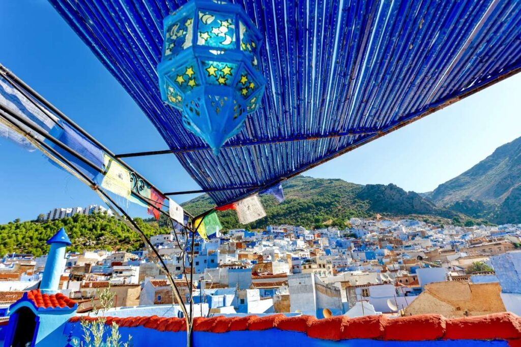 Panoramic view of Chefchaouen blue medina with Rif Mountains in Morocco