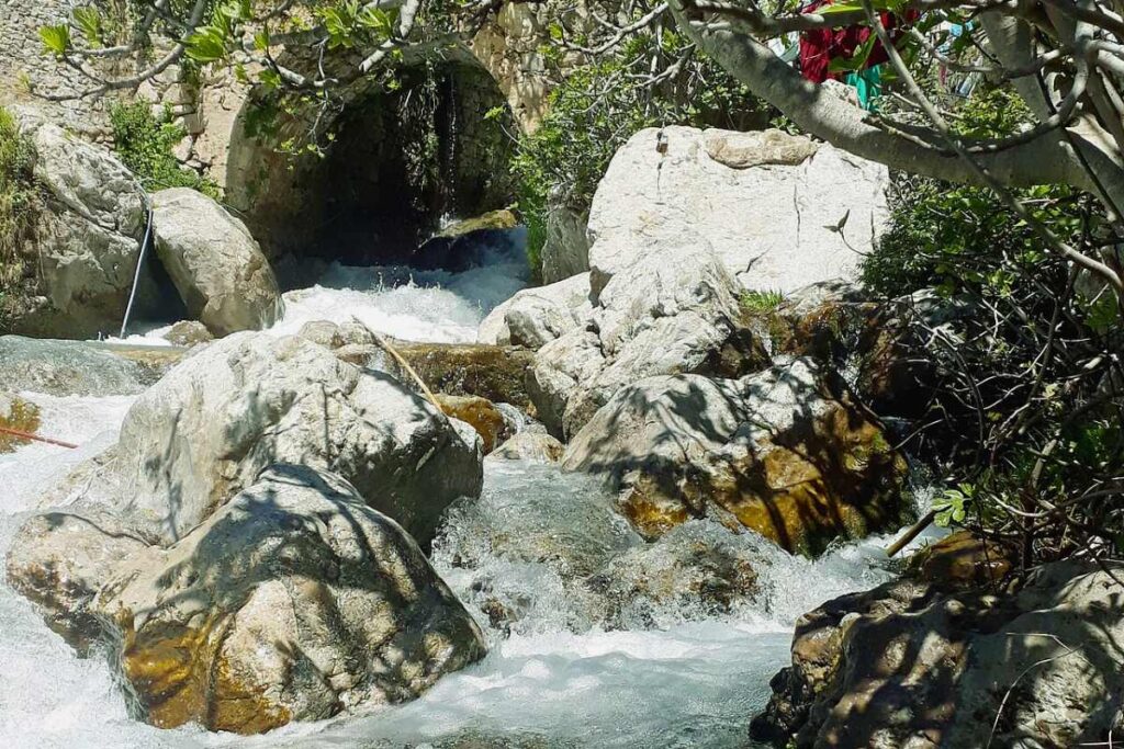 Mountain stream and small waterfall beside the old town